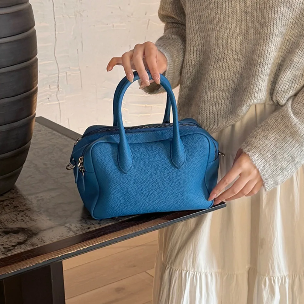 

Новая женская кожаная сумка в минималистичном стиле, повседневная, универсальная, с простой и изысканной текстурой, для ношения через плечо.