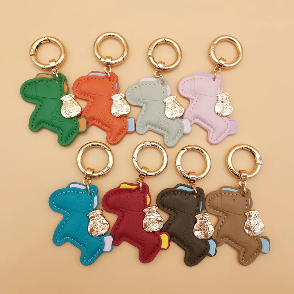 

New Creative Handmade Leather Pink Instant Money Pony Car Keychain Cartoon Rocking Horse Bag Pendant Cut Keychain