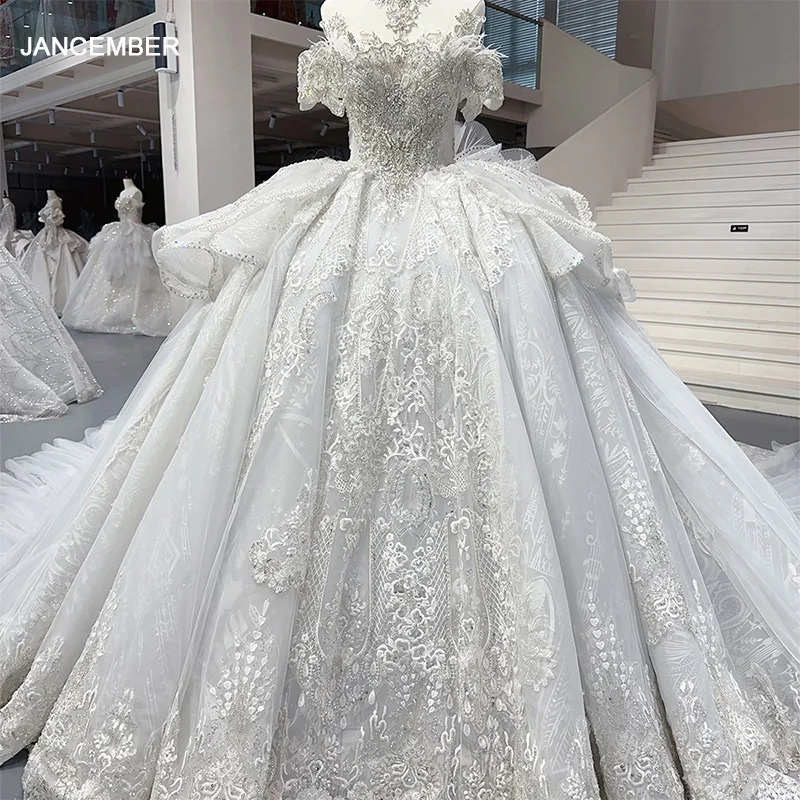 

Beading Pearls Appliques Lace Princess Ball Gown Feathers Wedding Dress With Short Sleeve Vestido De Noiva Princesa MN274