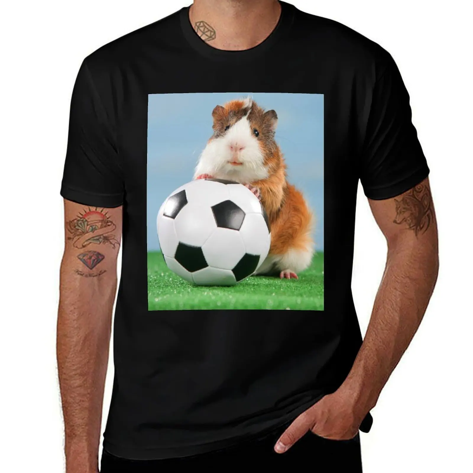 

Guinea pig sits on soccer ball T-Shirt t shirts for man graphic vintage man t shirt graphic cotton tshirt 100% T-shirt