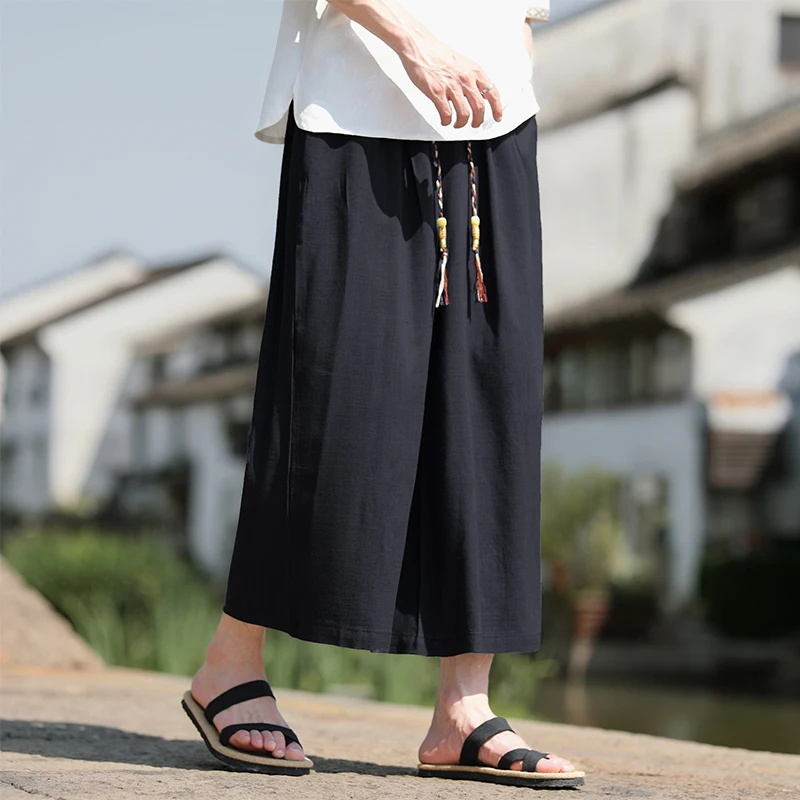 Pantaloncini larghi da uomo Pantaloni casual traspiranti estivi Gamba larga in cotone di lino Taglie forti 5XL Pantaloni Harajuku comodi da esterno da uomo