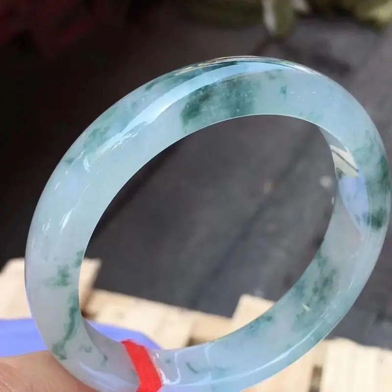 Jade bracelet with ice-like texture and floating floral patterns