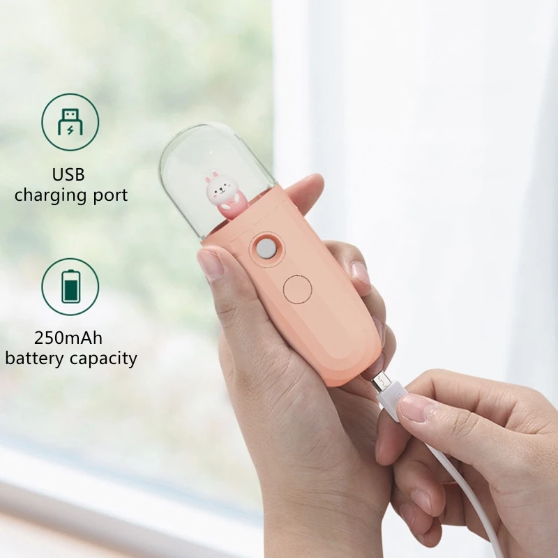 QYIYA เครื่องเพิ่มความชื้นใบหน้าสเปรย์นาโนแบบพกพาลายการ์ตูนไดโนเสาร์ตัวน้อยน่ารักจัดส่งแบบมือถือ