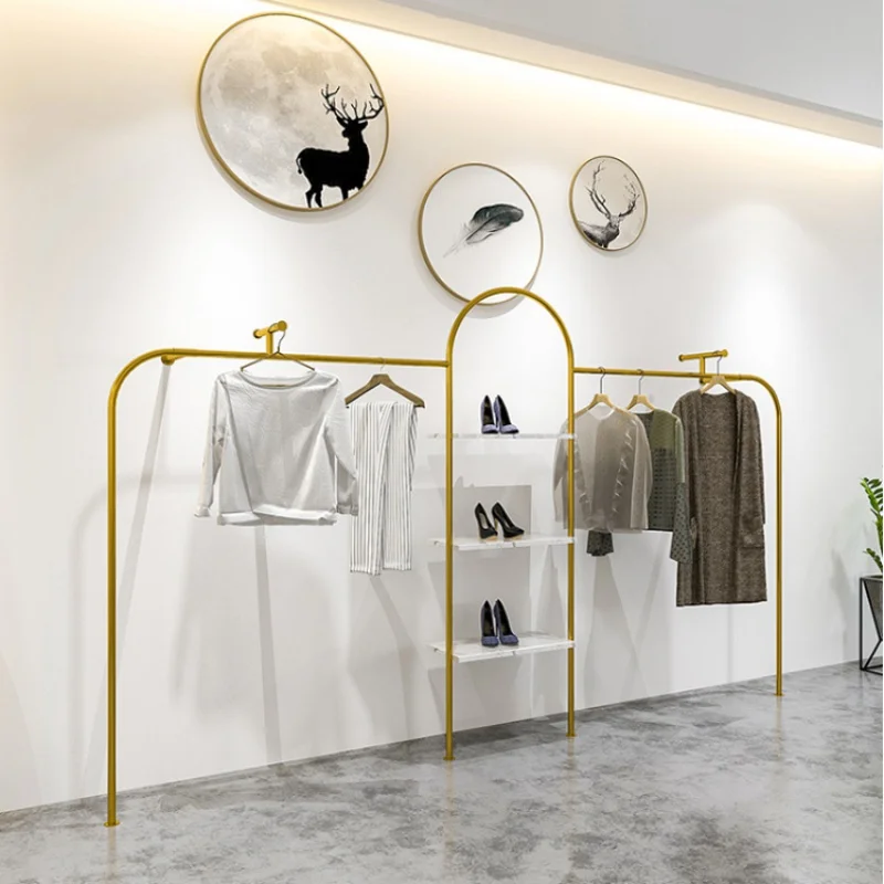 Custom, wall mounted gold metal hanging rack for clothing store showroom display stand furniture