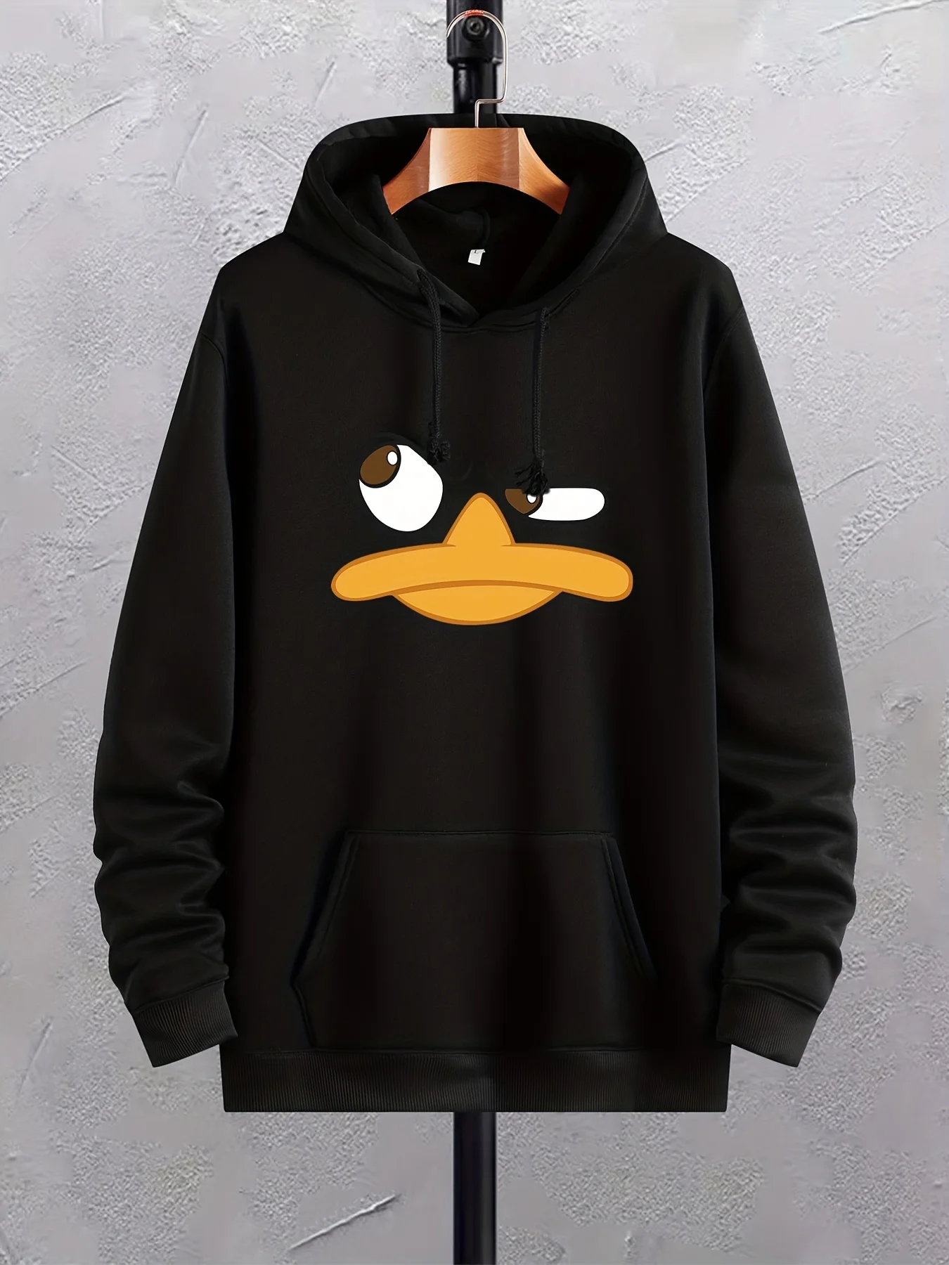 

A Christmas gift: a man with a cartoon duck-printed hoodie, a graphic hoodie and a kangaroo pocket trendy hoodie