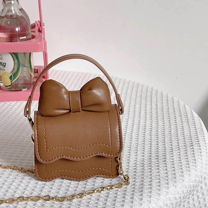 Nowość koreańska księżniczka Mini torba z kokardą dziecięca modna dekoracja dziewczyna łańcuszek torba Crossbody dziecięca pokrowiec na sukienkę BM169