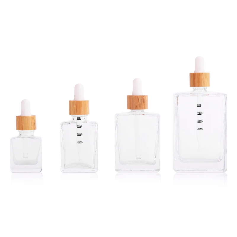 

Hot Sale 3Pcs Clear & Frosted Flat Rectangle Empty Glass Dropper Bottles with Bamboo Lids 15/30/50/100ml for Serum Essential Oil