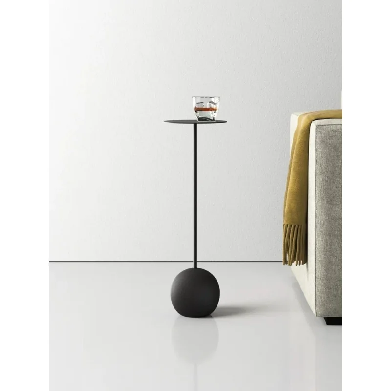 Simple and compact mini side table for the living room, placed beside the sofa. Designer model, retro black cement side table.