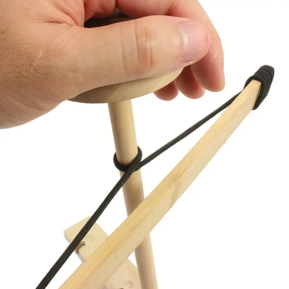 كيفية استخدام جهاز قطع الخشب بالفرiction (Bow Drill) للاحتراق في الطبيعة