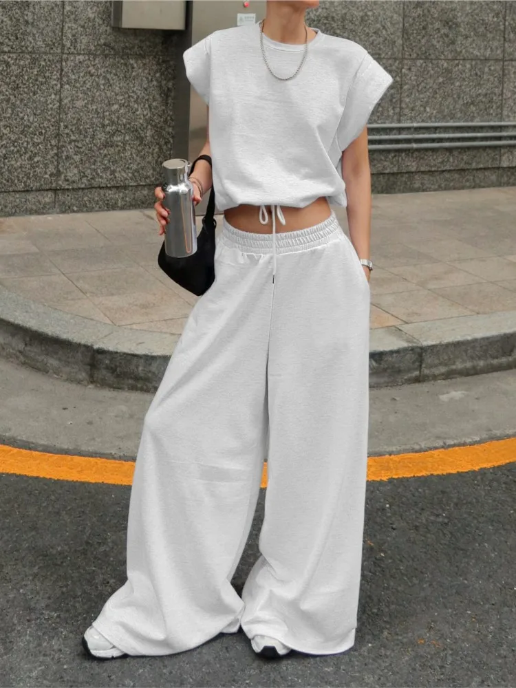 

Женский модный повседневный костюм: топ без рукавов с круглым вырезом и завязками на талии, широкие брюки — комплект из двух предметов для весны и работы