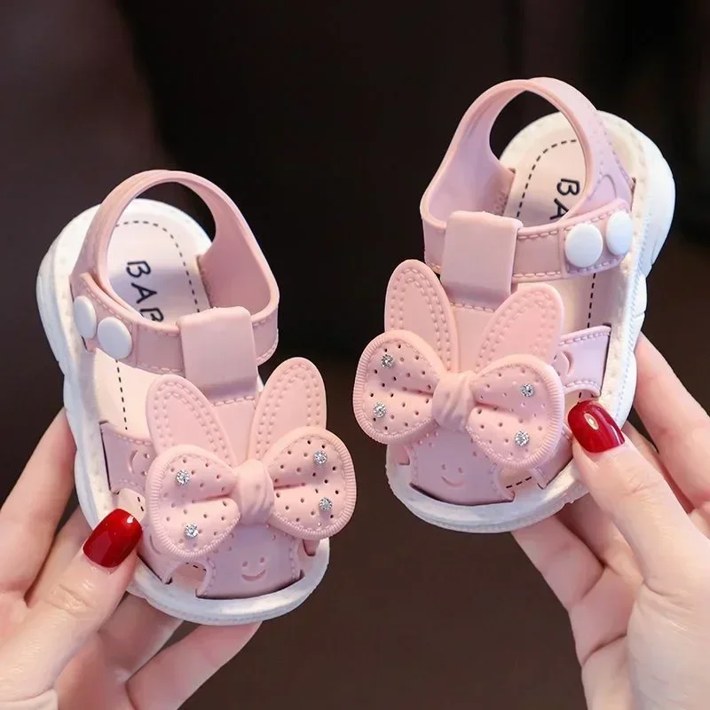 Scarpe estive per bambini con fiocco solido Sandali antiscivolo da spiaggia in PVC carino per neonate Calzature Sandali morbidi per bambini alla moda