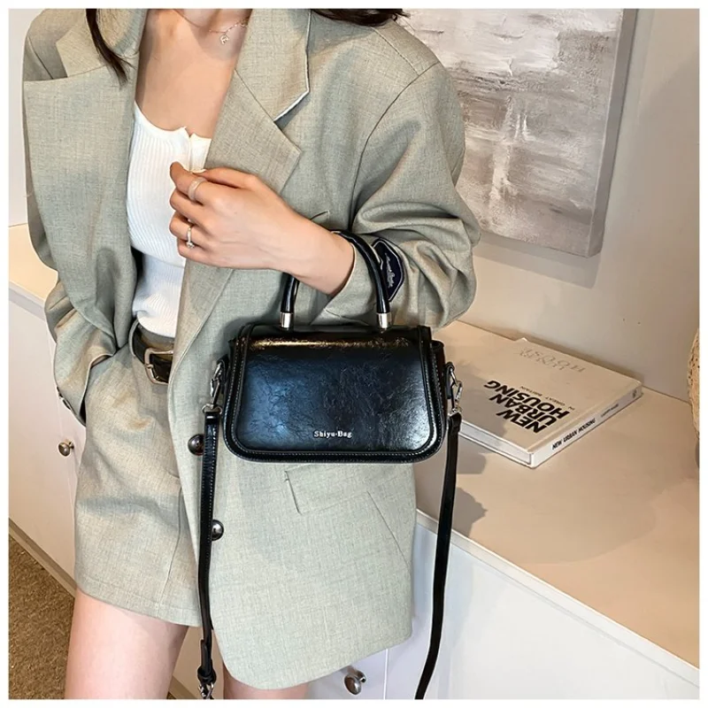 

Women's Versatile Black Patented Leather Mini Crossbody Bag with Brand Logo for Work, Errands, Travel and Everyday Wear Handbag