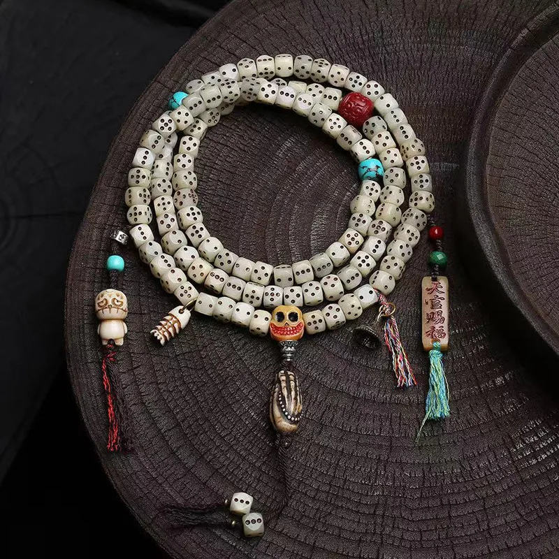 

Tibetan-style bone carving dice with 108 beads, necklace with cinnabar swastika beads, camel bone A-daiBring wealth bracelet