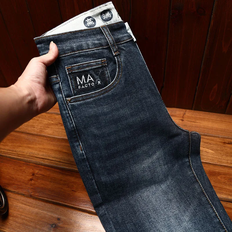 Jeans classici semplici pantaloni Casual versatili dritti larghi alla moda da uomo pantaloni da lavoro elasticizzati di grandi dimensioni lavati retrò autunno