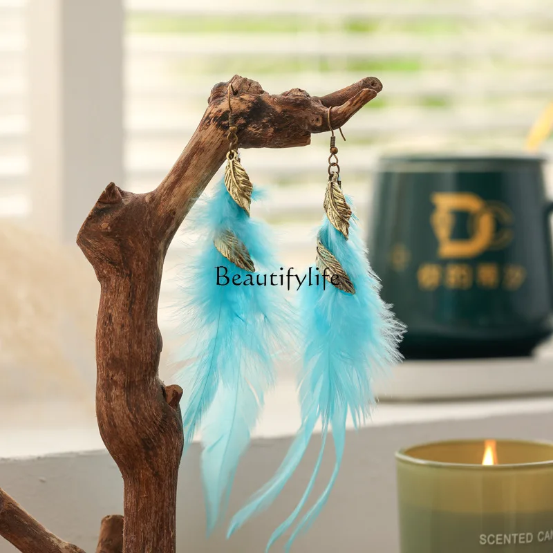 

Feather earrings, long twisted metal retro earrings.