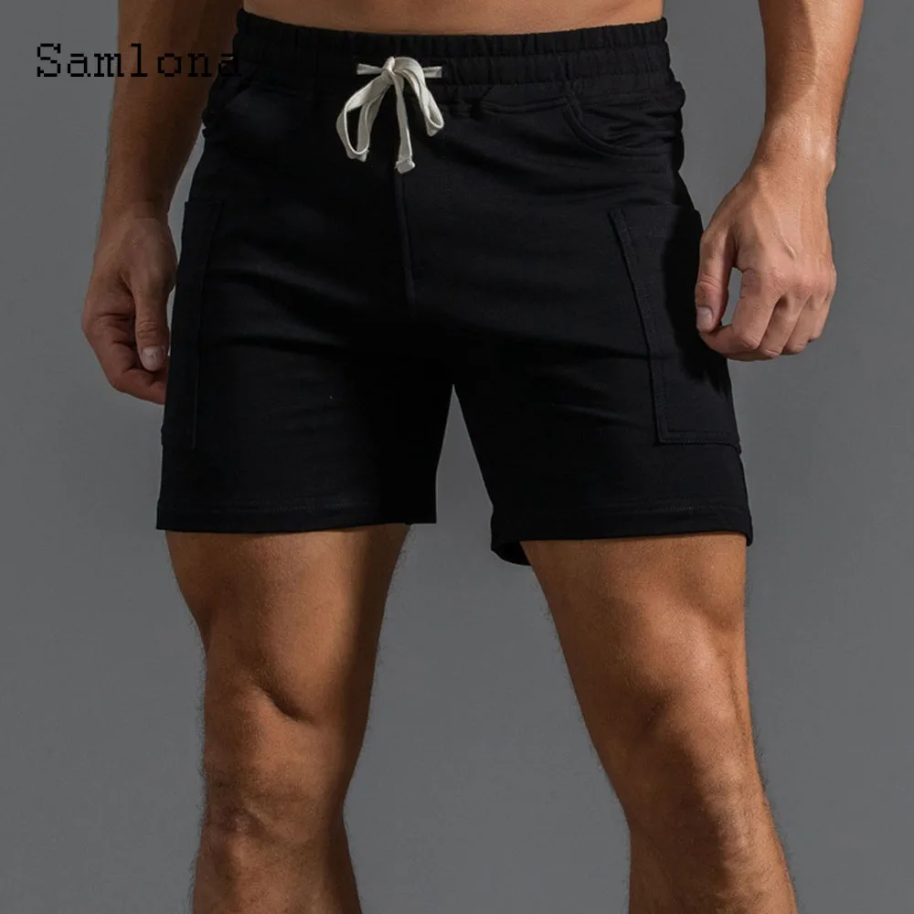 2025 ฤดูร้อนใหม่กางเกงขาสั้นสบายๆผู้ชายเซ็กซี่เอวยางยืดกางเกงขาสั้นชายขาตั้งกระเป๋าฟิตเนสชายหาดสั้นกางเกงสีเทาสีขาว