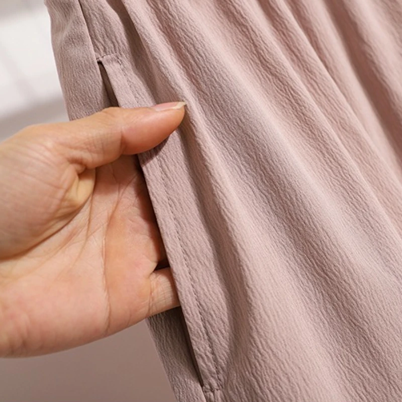 Damskie sportowe szorty z wysokim stanem, luźny krój, szerokie nogawki, jednolity kolor, kieszenie, elastyczna talia, krótkie spodnie, nowy styl 2025.