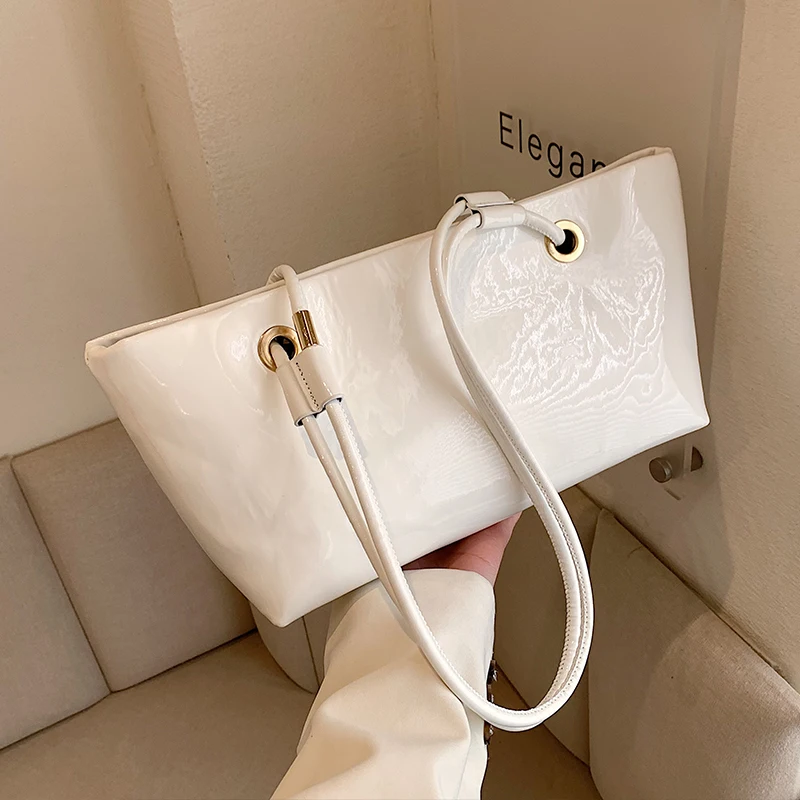 Spring Summer 2024 New Lacquer Leather One Shoulder Underarm Bag Fashionable Solid Color Commuter Tote Bag Women\'s Bright Bag