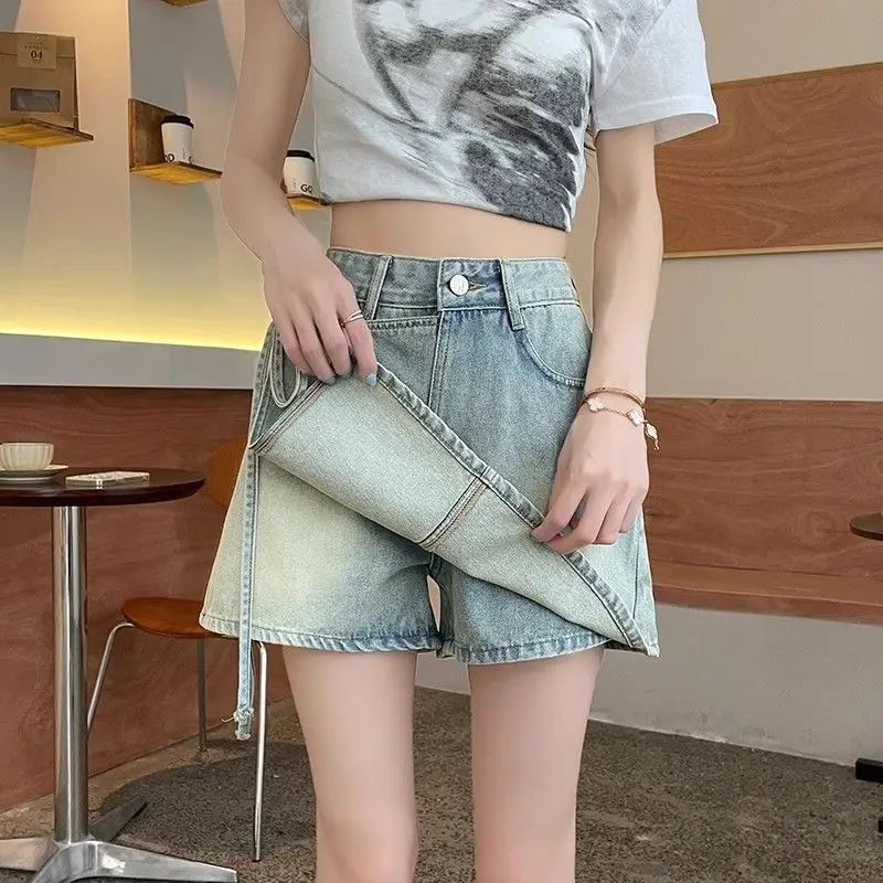 Fake two pieces of denim shorts women\'s summer new A-shaped high waist irregular western-style strap skirt slim Joker hot pants.