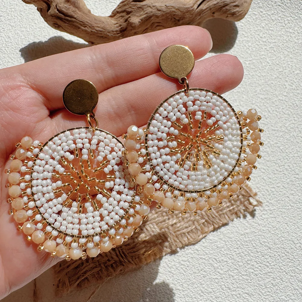 

ZGMXR Rice bead earrings Crystal Circle Bohemia Creativity Sunflower Hand weaving Alloy Female Fashion Simple Beaded earrings