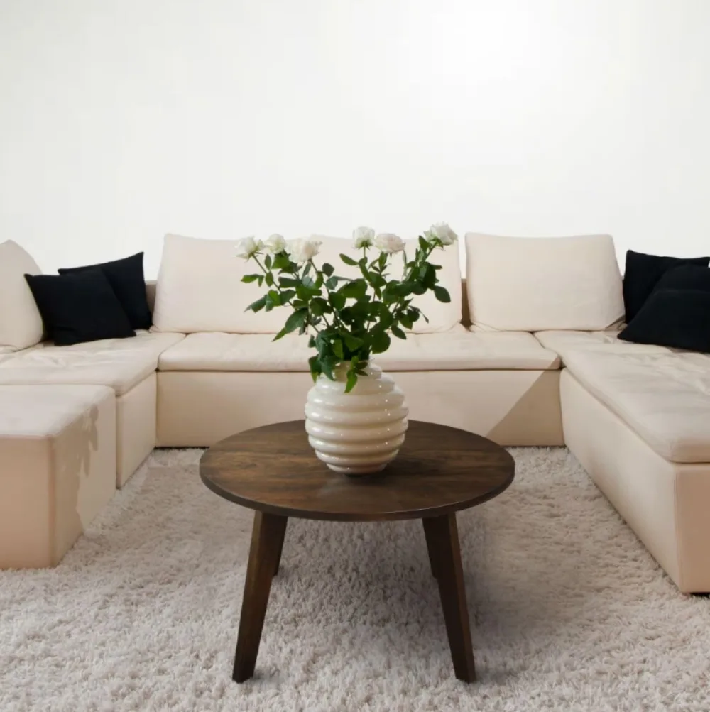 

24 in. Cherry Wood Medium Round Wood Coffee Table 4-durable legs provide balanced support.