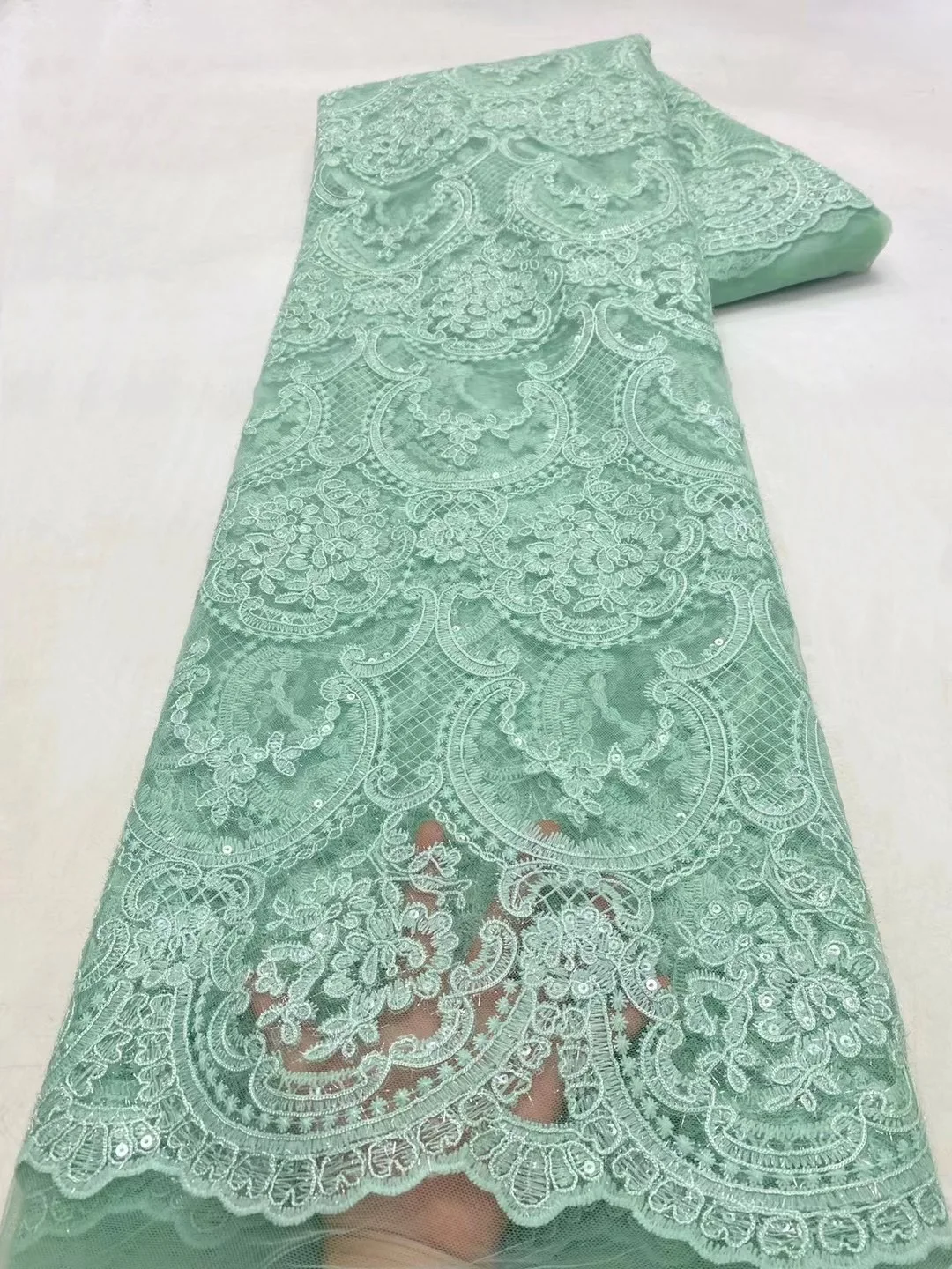 

2022 High Quality Nigerian Design Cyan Green Lace Fabric French Milk Silk Lace African Weaving Sequins Fabric For Women Dress