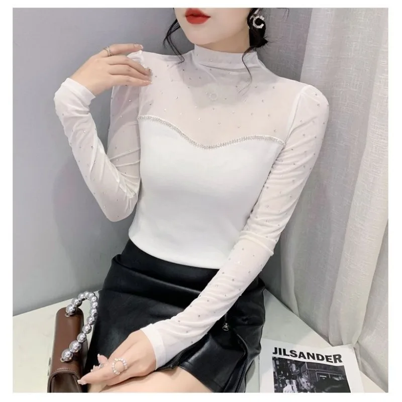 Camisa de manga larga versátil y sexi con cuentas de diamantes calientes empalme de malla de moda adelgazante europea de otoño