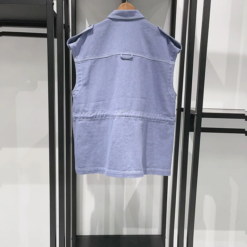 

Women's blue denim vest with pockets, drawstring waist and fashionable ladies tops