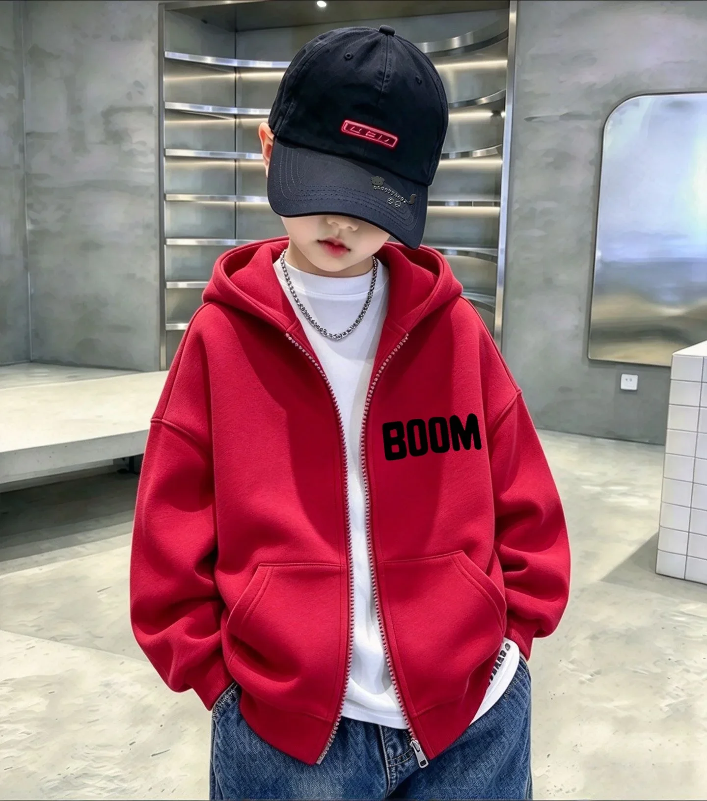 Children's hooded zip-up jacket featuring a minimalist "BOOM" graphic; suitable for both boys and girls in winter. 2