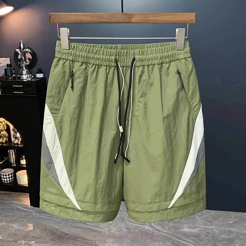 

Summer quick drying loose sports shorts for men 2026 new trend versatile, comfortable, breathable and casual five quarter pants