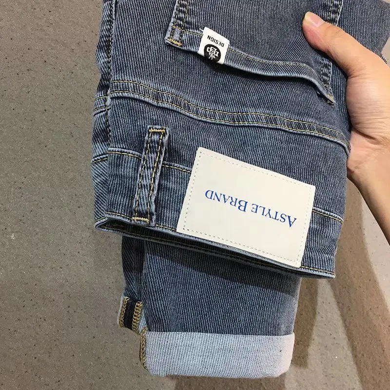 Jeans in Denim blu 2022 di alta qualità da uomo costosi Leggings coreani Slim Fit ricamati pantaloni in Twill elastico a vita media di fascia alta