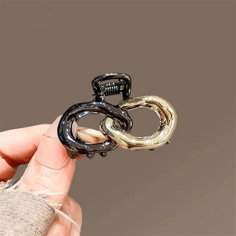 Small Hair Claw Clip Women Dual Interlocking Loop Design Glossy Black and Gold Plated Metal Alloy