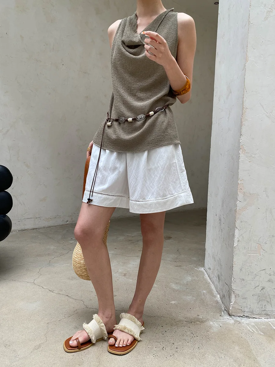 Sommerliche Damen-Shorts in unifarbenem Design mit hohler Textur, elastischem, hohem Bund, schlank machendem und lockerem, weitem Bein. – Detail 14