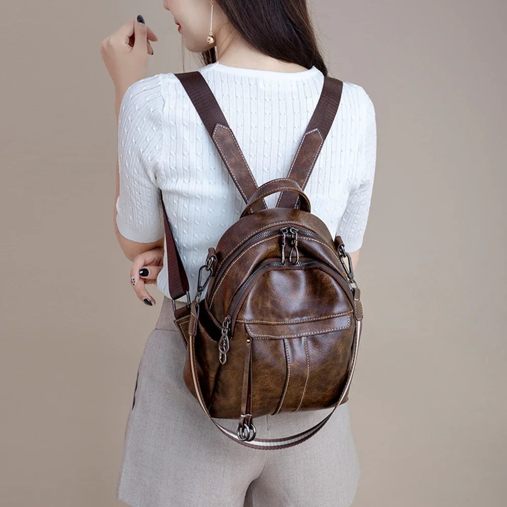 Mochila pequeña de cuero genuino para mujer, bolso de hombro de piel de vaca suave de alta calidad, bolso de diseño con cremallera de moda