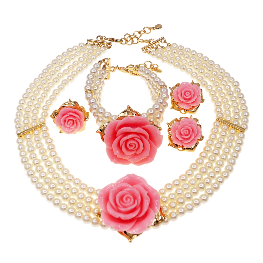 

A unique and elegant multi-layer pearl jewelry set with romantic pink flowers as an engagement gift for a sweet girl