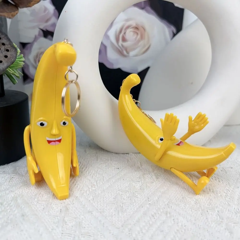 Exquisite Funny Big Banana Keychain Creative Music Singing Banana Keyring Standing Plastic Movable Hand Banana Pendant Unisex