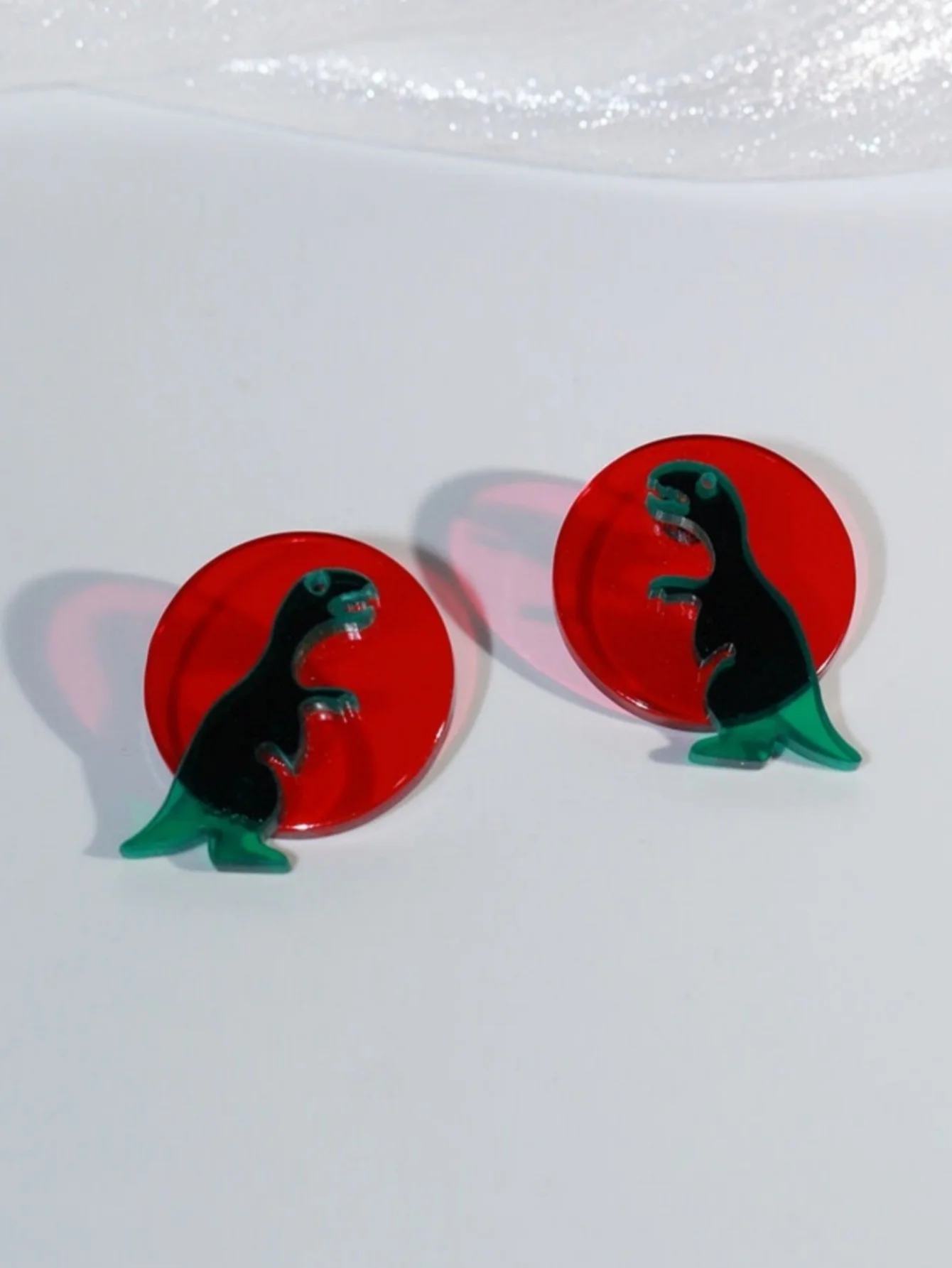 A Pair of Cute Cartoon Transparent Geometric Dinosaur Earrings in Contrasting Colors