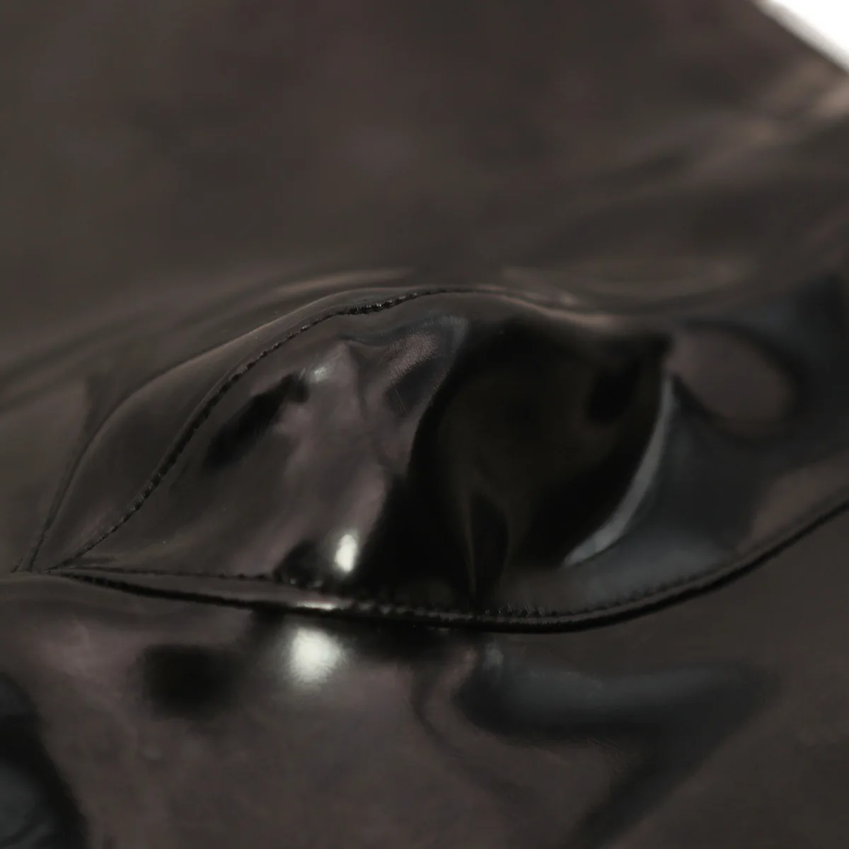 男性用セクシーなPUレザーのスキニーパンツ、スリムで伸縮性があり光沢のあるスタイリッシュなパンツ