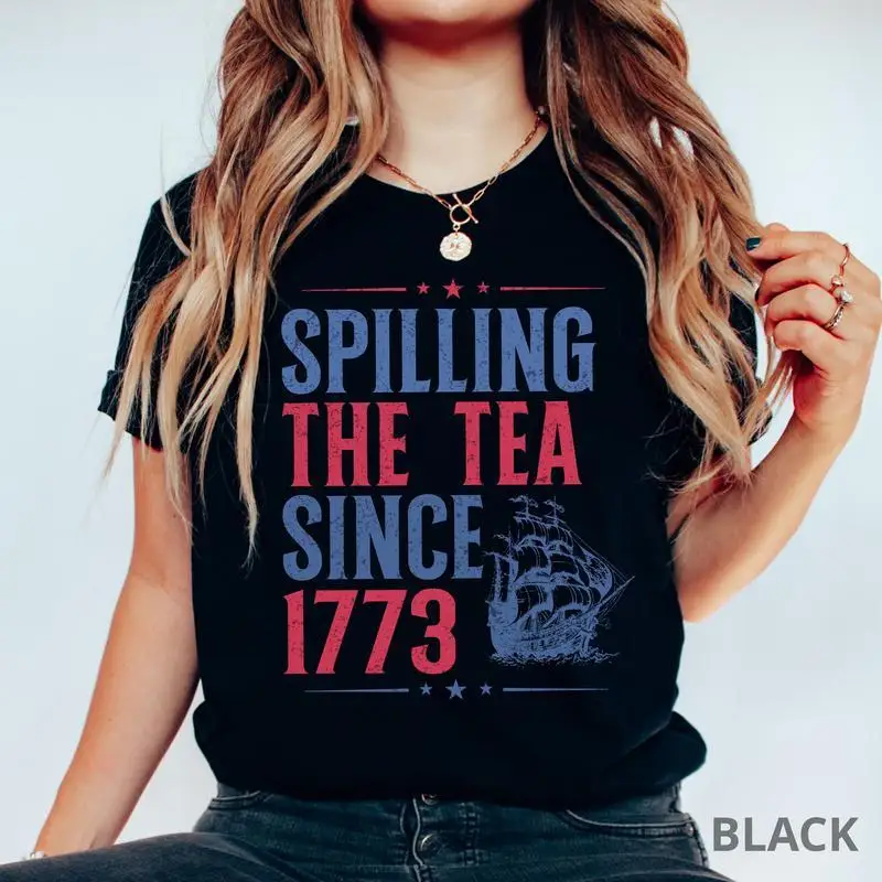 

Funny "Spilling The Tea Since 1773" T-shirt, Vintage American History Graphic Tee, Boston Tea Party Patriotism Crewneck