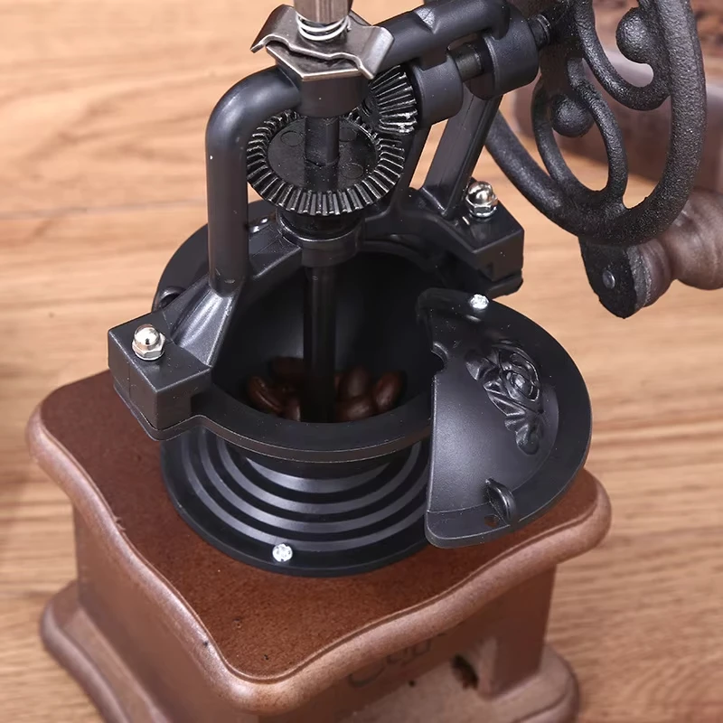 الكلاسيكية اليد هزة حبوب القهوة طاحونات العجلة الكبيرة القديمة آلة القهوة اليدوية الحديد الزهر الخمر هزة طحن حبوب القهوة