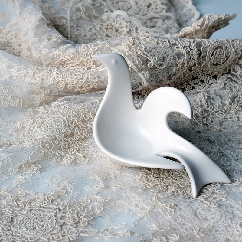 

Beige Matte Ceramic Peace Dove Candlestick Decorative Ornament