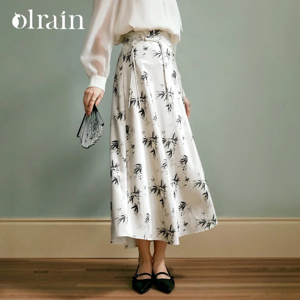 OLrain Prairie Chic Style Satin Skirt Women Autumn 2026 A-line Elegant Printing High-waist Tassels Button Skirts M56QB90120