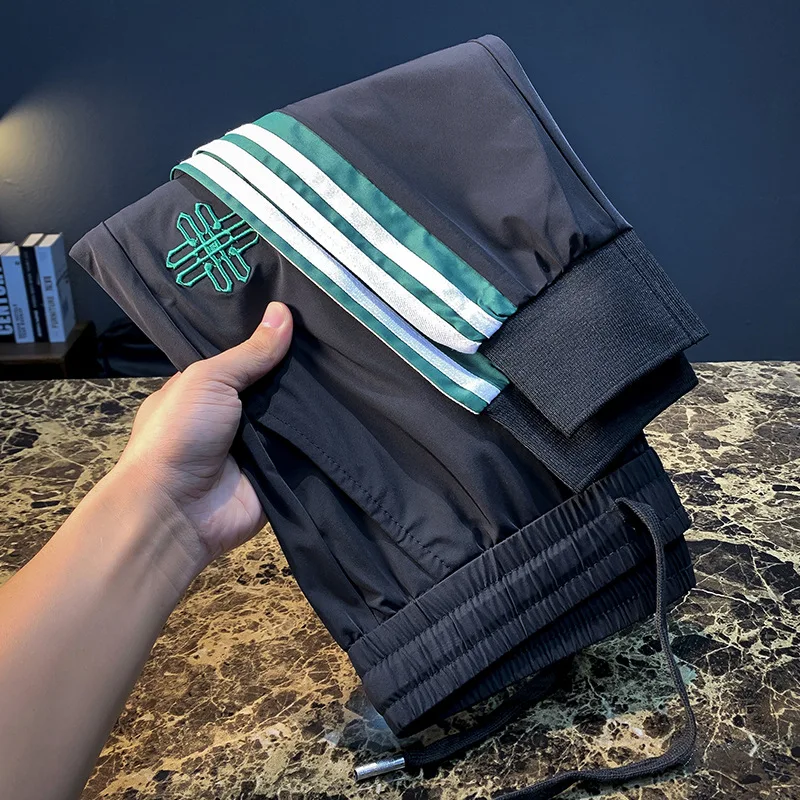 

2025 New Ice Silk Casual Pants for Men's Summer, Thin, Sports Trendy, Light Luxury, High End Embroidered Quick Drying Pants