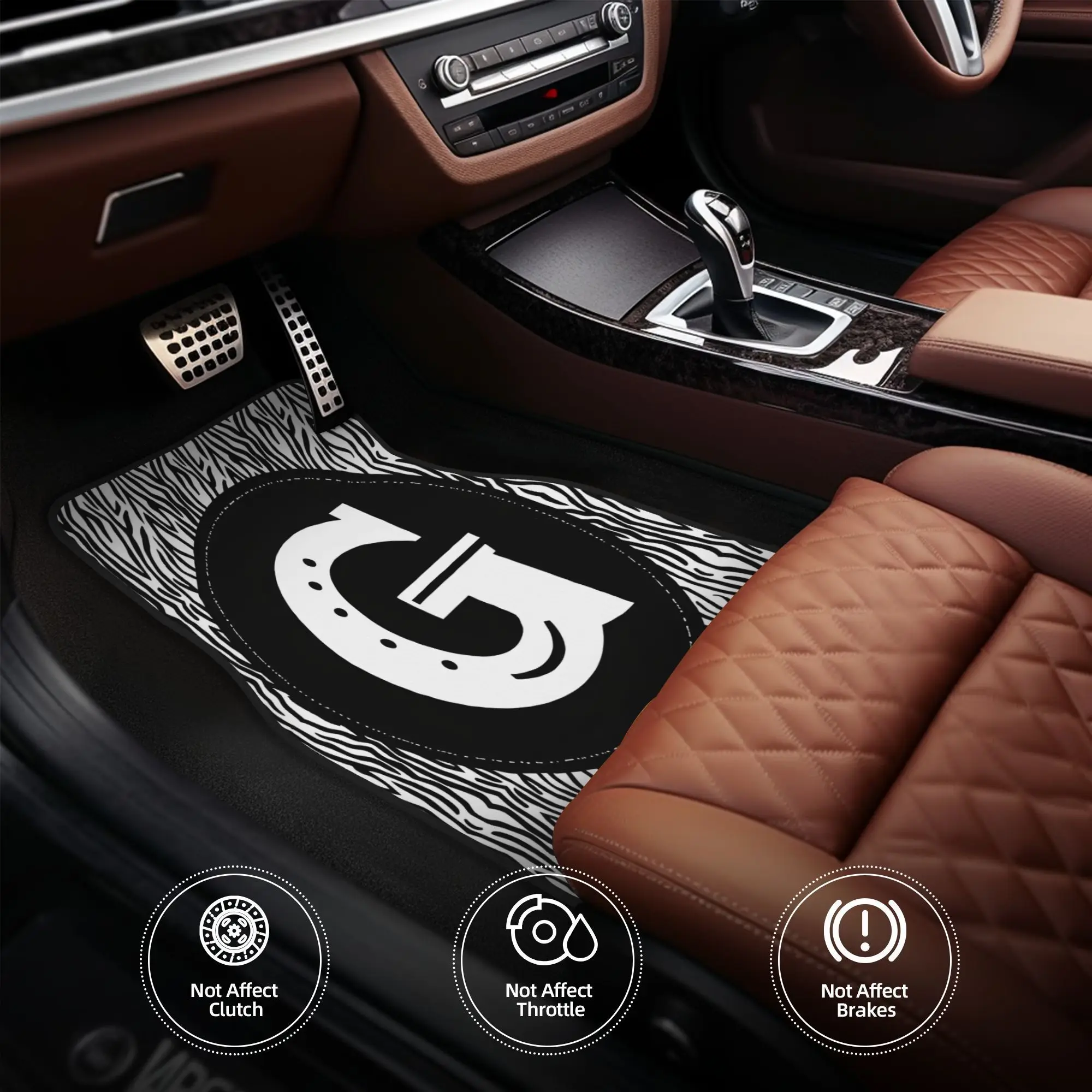 A Set Of Four Car Floor Mats Featuring A Black And White Zebra Pattern Shaped Like The Letter G, Perfect For Everyday Use, Weeke