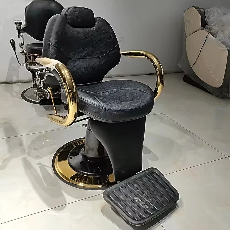 

Vintage Black Leather Barber Chair With Gold Armrests And Footrest