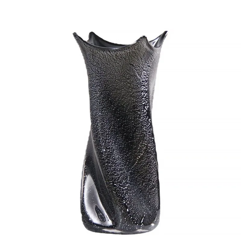 

Black silver foil reversed glazed vase, soft decoration in the model room of the sales office
