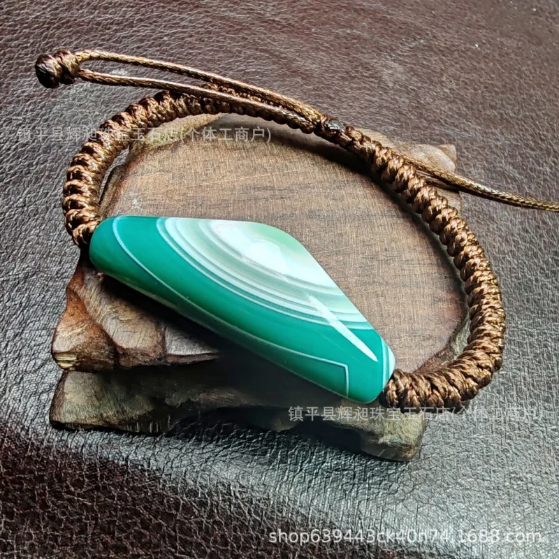 Braided bracelet made of Sardonyx Dzi beads with natural shapes and high oil content