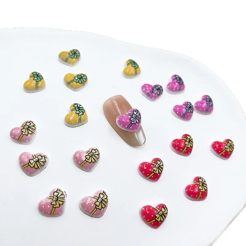100 unids/pack 9 × 11mm caja de regalo de corazón dijes de resina para uñas-arte de uñas con lazo 3D, bonita decoración de uñas a presión para manicura romántica DIY