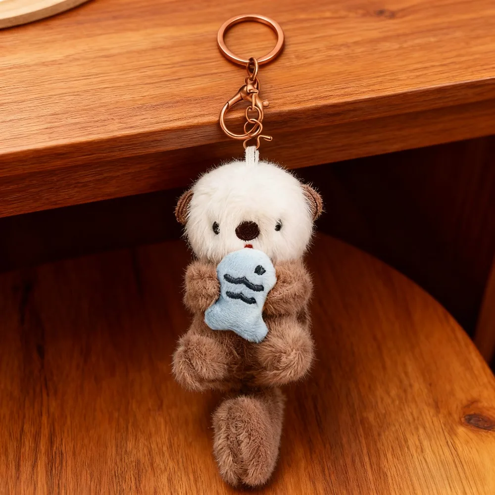 Cute‑Style Otter Plush Keychain Holding Fish - Soft Plush with Exquisite Stylized Design, Adorable Trendy Toy Aesthetic - Bag Charm Decor Accessory To Add A Playful Vibe