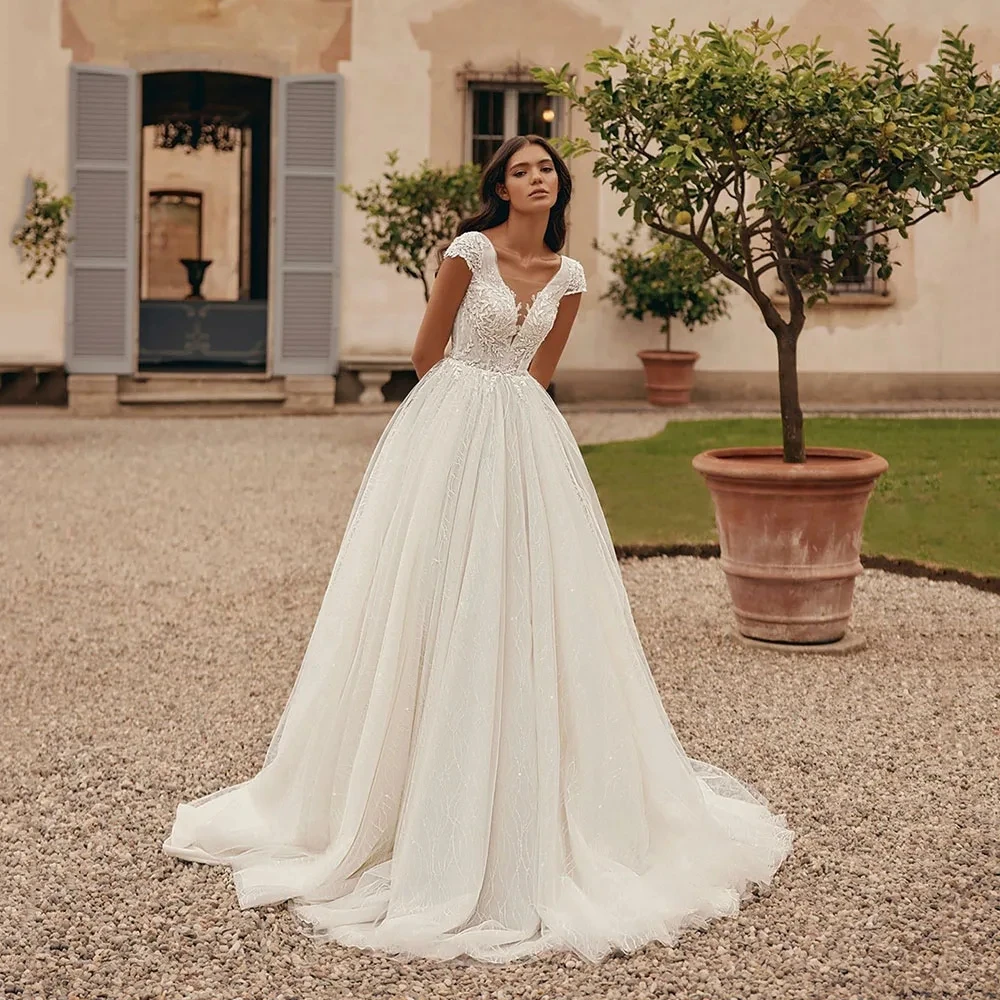 Eleganti abiti da sposa per le donne Sexy abito da sposa Appliques di pizzo Backless senza maniche profondo scollo a v Vintage Robe Vestidos De Novia